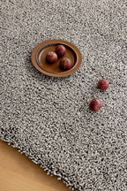 Brink & Campman Origin High Stone vloerkleed in een interieur