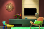 Karlsson wandklok Sunflower MDF, hout finish, sfeerfoto: aan roodbruine wand boven tv-meubel met bloemen