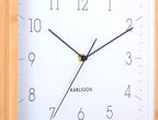Karlsson wandklok Neat Cuadrado, wit, detail: zwarte wijzers en cijfers, gouden middenpunt, Karlsson-logo