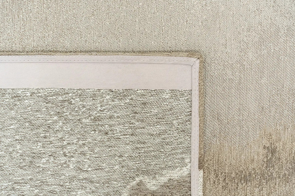 Close-up van het dessin van het Louis de Poortere Meditation Lagoon 2082 Beach vloerkleed