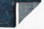 Achterkant van het Louis de Poortere Fading World Medallion 8254 Blue Night vloerkleed