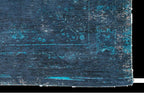 Louis de Poortere Fading World Medallion 8254 Blue Night vloerkleed met een plooi, dun en soepel