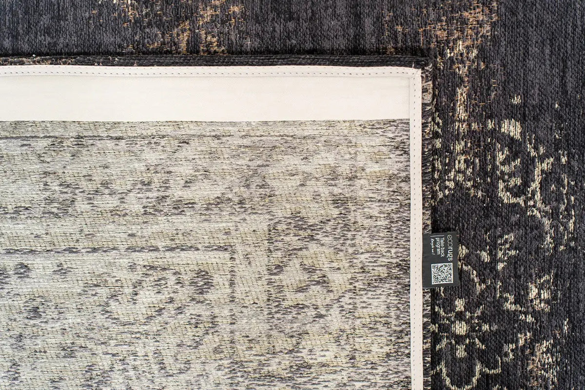Close-up van het dessin van het Louis de Poortere Fading World Medallion 8263 Mineral Black vloerkleed