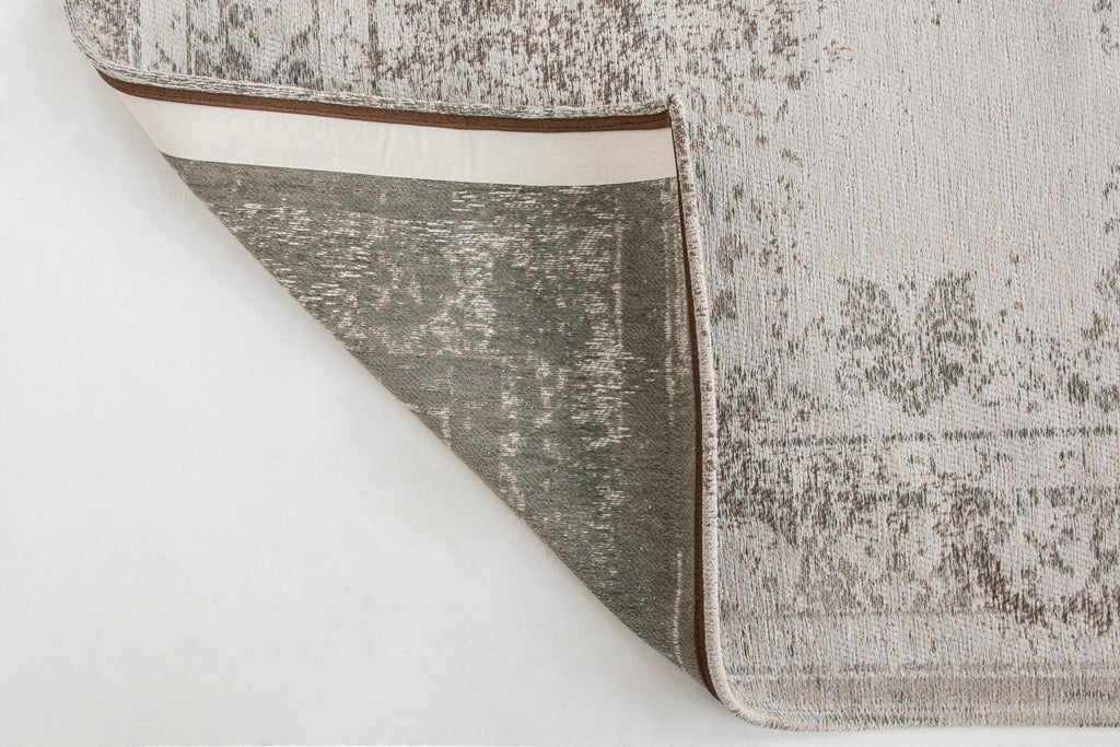 Achterkant van het Louis de Poortere Fading World Medallion 8383 Salt & Pepper vloerkleed