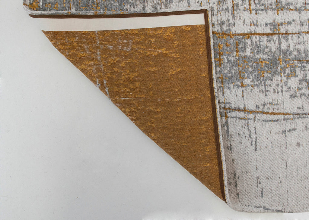 Achterkant van het Louis de Poortere Mad Men Griff 8419 Columbus Gold vloerkleed