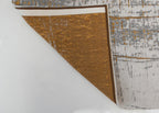Achterkant van het Louis de Poortere Mad Men Griff 8419 Columbus Gold vloerkleed