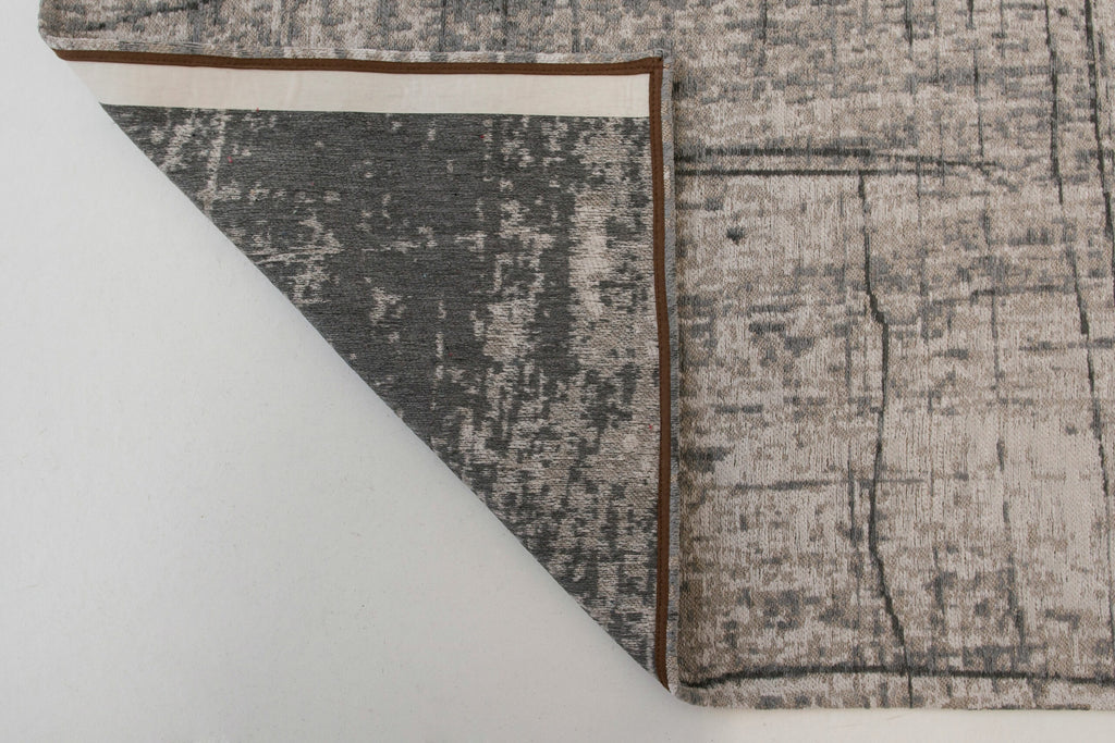 Achterkant van het Louis de Poortere Mad Men Griff 8420 Jersey Stone vloerkleed