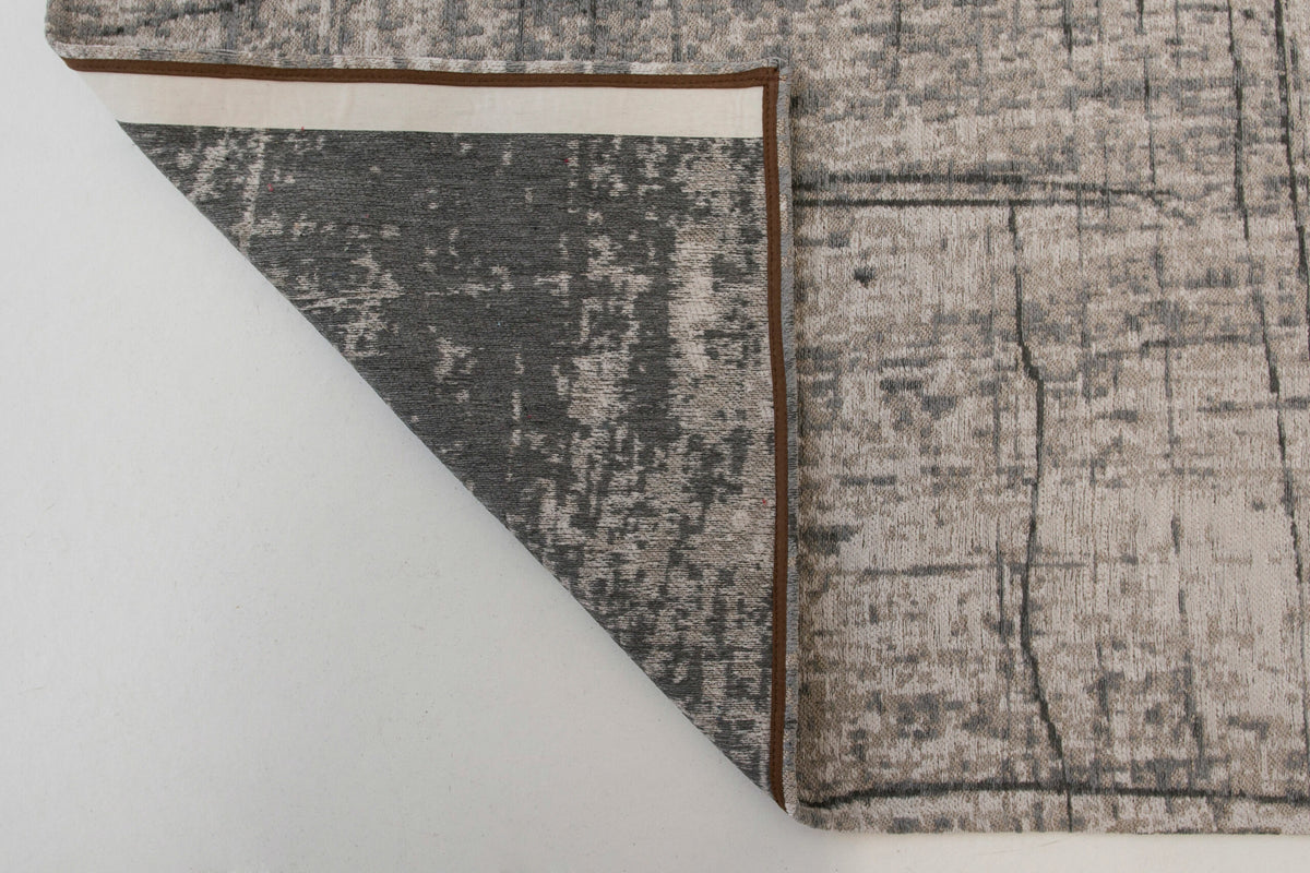 Achterkant van het Louis de Poortere Mad Men Griff 8420 Jersey Stone vloerkleed