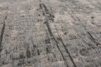 Close-up van het dessin van het Louis de Poortere Mad Men Griff 8420 Jersey Stone vloerkleed