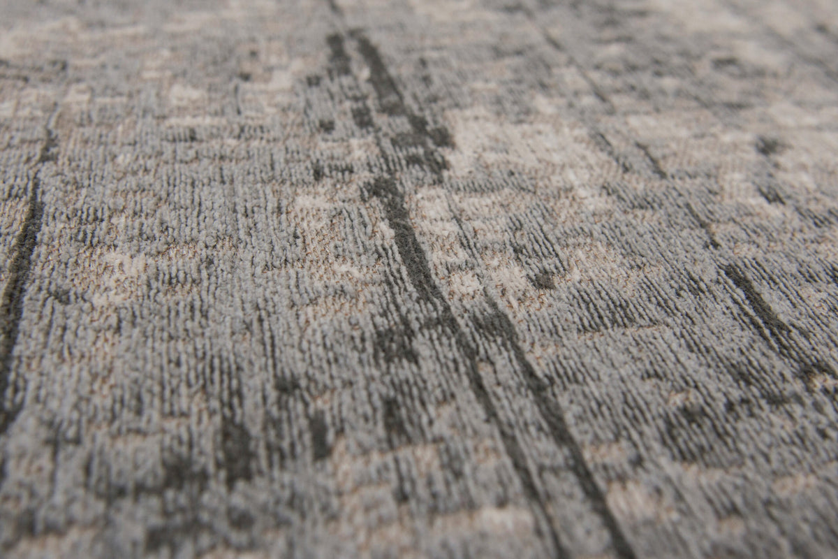 Close-up van het dessin van het Louis de Poortere Mad Men Griff 8420 Jersey Stone vloerkleed