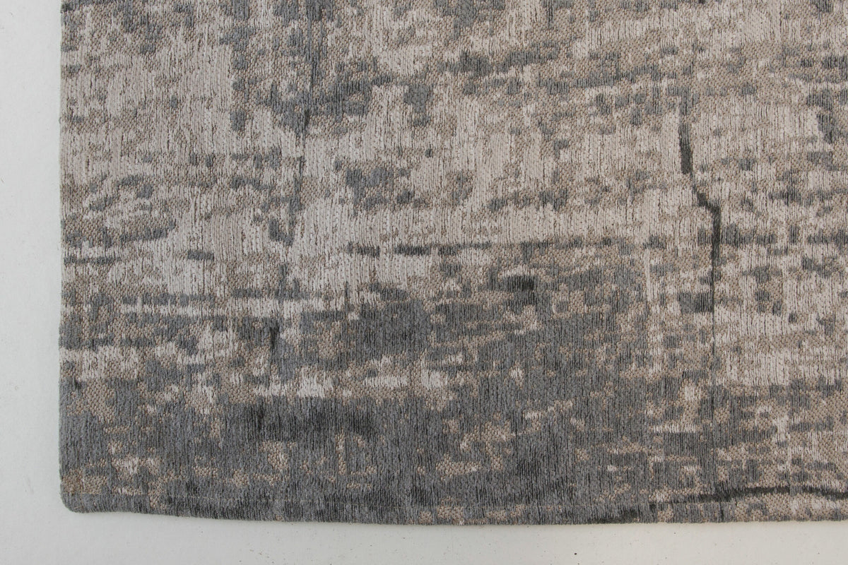 Zijaanzicht van het Louis de Poortere Mad Men Griff 8420 Jersey Stone vloerkleed