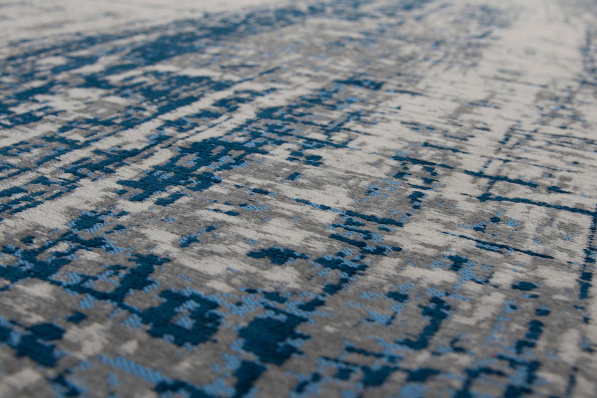 Close-up van het dessin van het Louis de Poortere Mad Men Griff 8421 Bronx Azurite vloerkleed