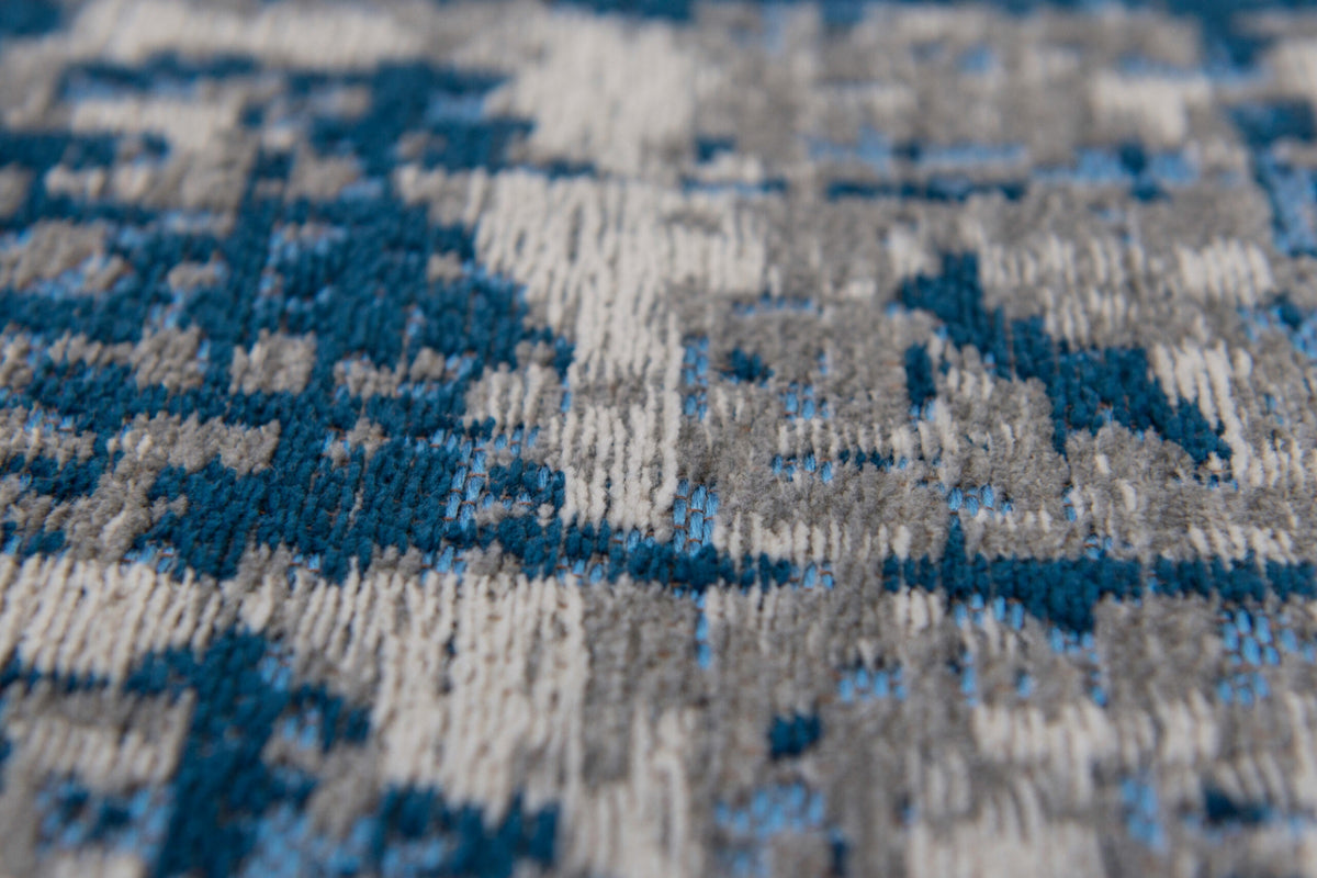 Close-up van het dessin van het Louis de Poortere Mad Men Griff 8421 Bronx Azurite vloerkleed