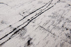 Close-up van het dessin van het Louis de Poortere Mad Men Griff 8926 Metro Black & White vloerkleed