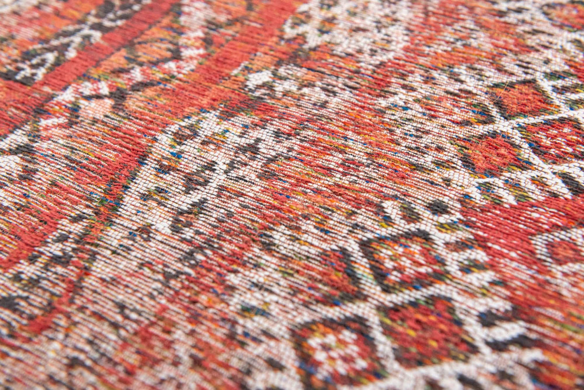 Close-up van het dessin van het Louis de Poortere Antiquarian Kilim 9115 Fez Red vloerkleed