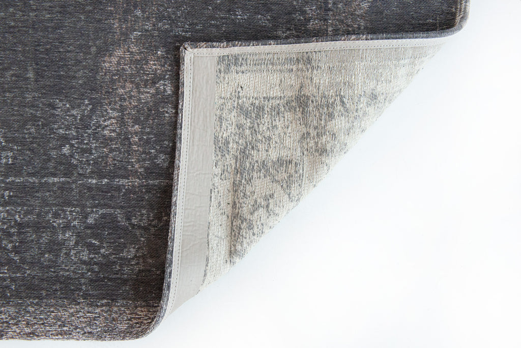 Achterkant van het Louis de Poortere Fading World Medallion 9148 Stone vloerkleed