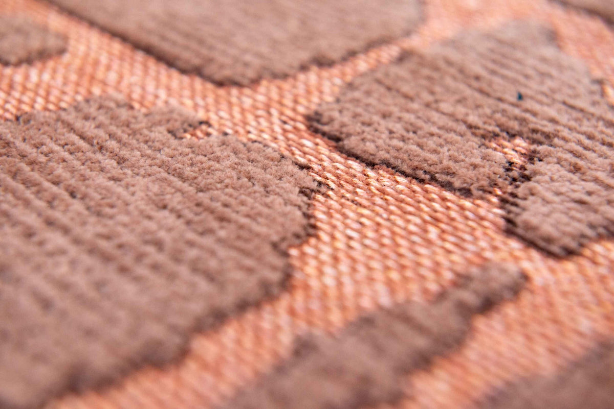 Close-up van het dessin van het Louis de Poortere Structures Baobab 9199 Za Copper vloerkleed
