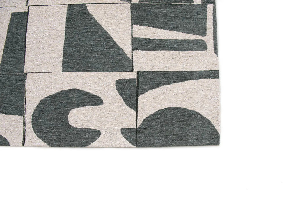 Zijaanzicht van het Louis de Poortere Craft Papercut 9361 Sea Spray vloerkleed