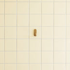 Normann Copenhagen Wandhaken Curve Mini Hooks Mat Goud (2 stuks) in een interieur